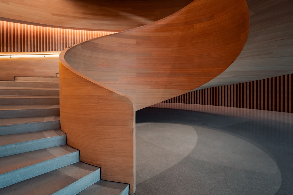 Double-height main hall with floating steel staircase