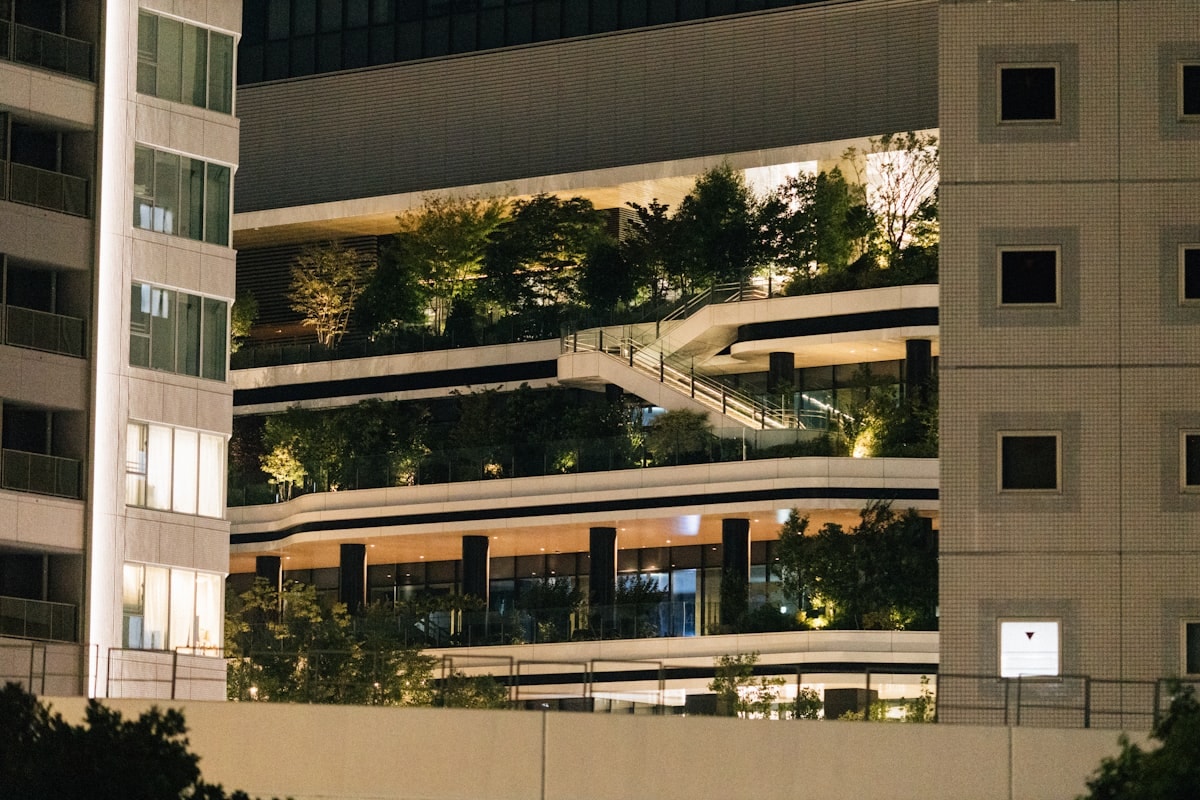 Gallery facade at night with illuminated concrete panels