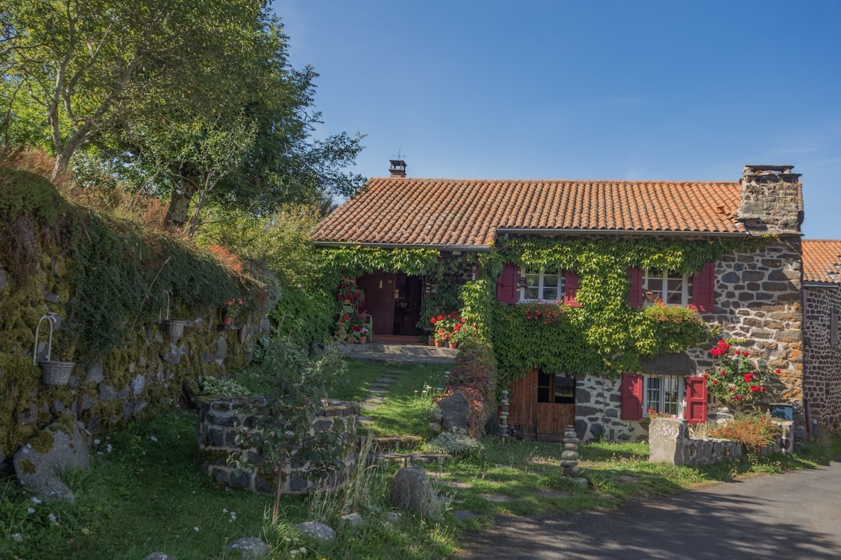 Recessed entrance carved into stone mass with bronze door