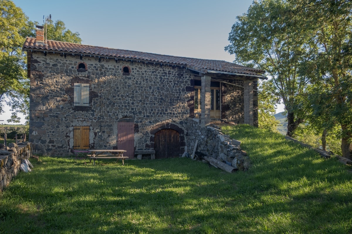 Floor-to-ceiling window framing rose-red canyon walls