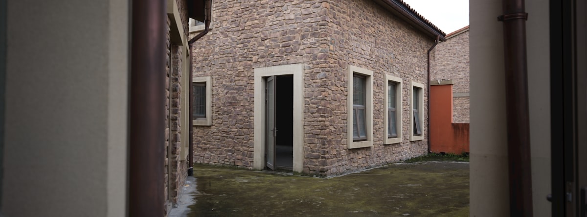 Villa Serene exterior facade showing limestone walls and deep overhangs