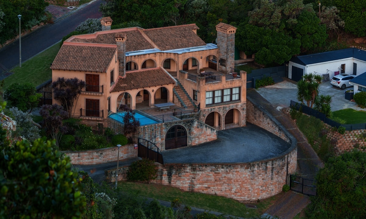 Rooftop terrace with outdoor dining area and evening city lights
